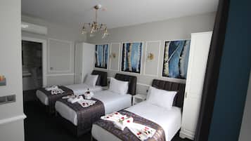 Triple Room | Premium bedding, minibar, in-room safe, desk