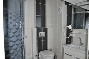 Shower, free toiletries, hair dryer, slippers