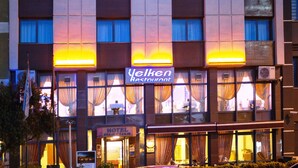 A hotel named HOTEL marina with a modern facade, multiple windows, and a visible restaurant sign below. - Hotel Villa Marina (Bandirma)
