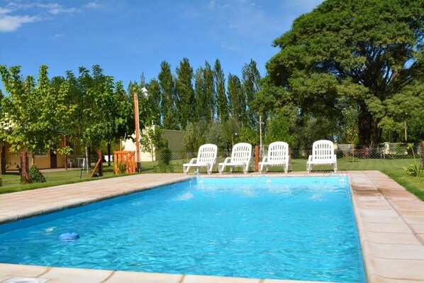 Seasonal outdoor pool, pool umbrellas