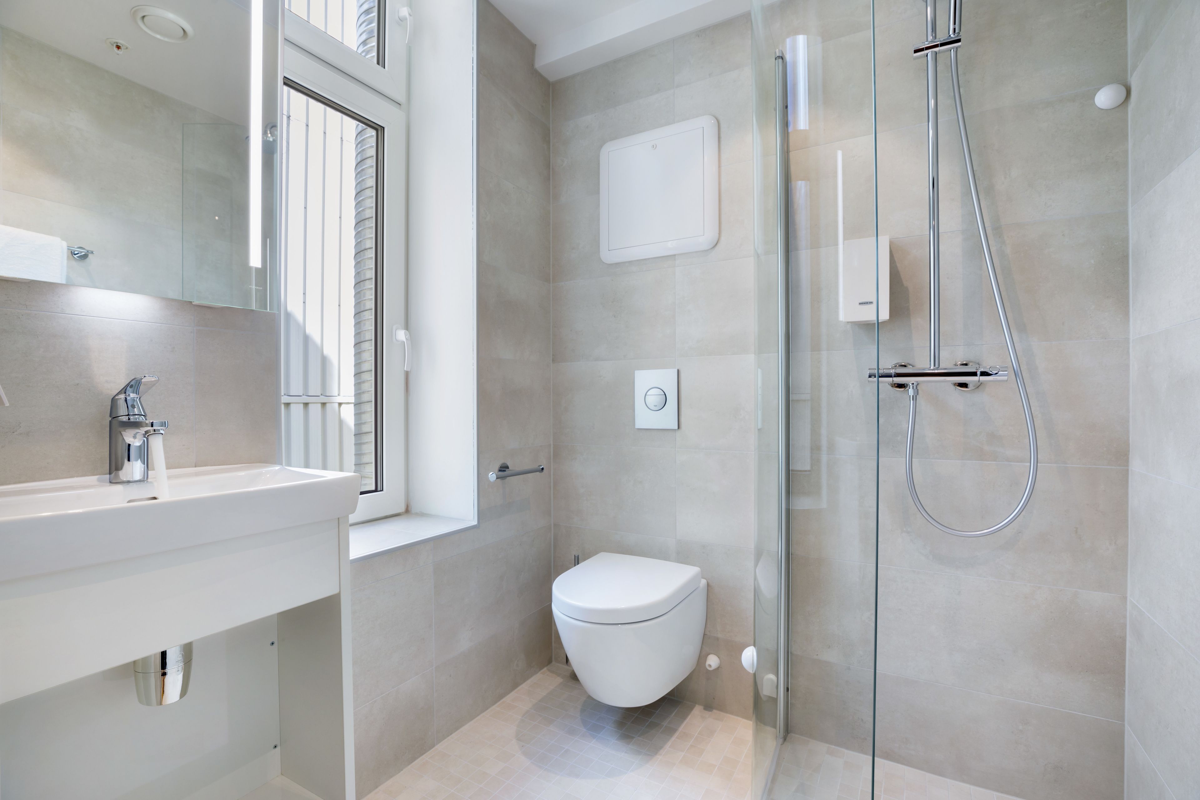 shower, rainfall showerhead, hair dryer, towels