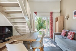 Apartment, 1 Bedroom (Mezzanine) | Soundproofing, cribs/infant beds, free WiFi, bed sheets