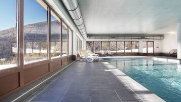 Relax by the pool with a breathtaking view of the surrounding mountains.