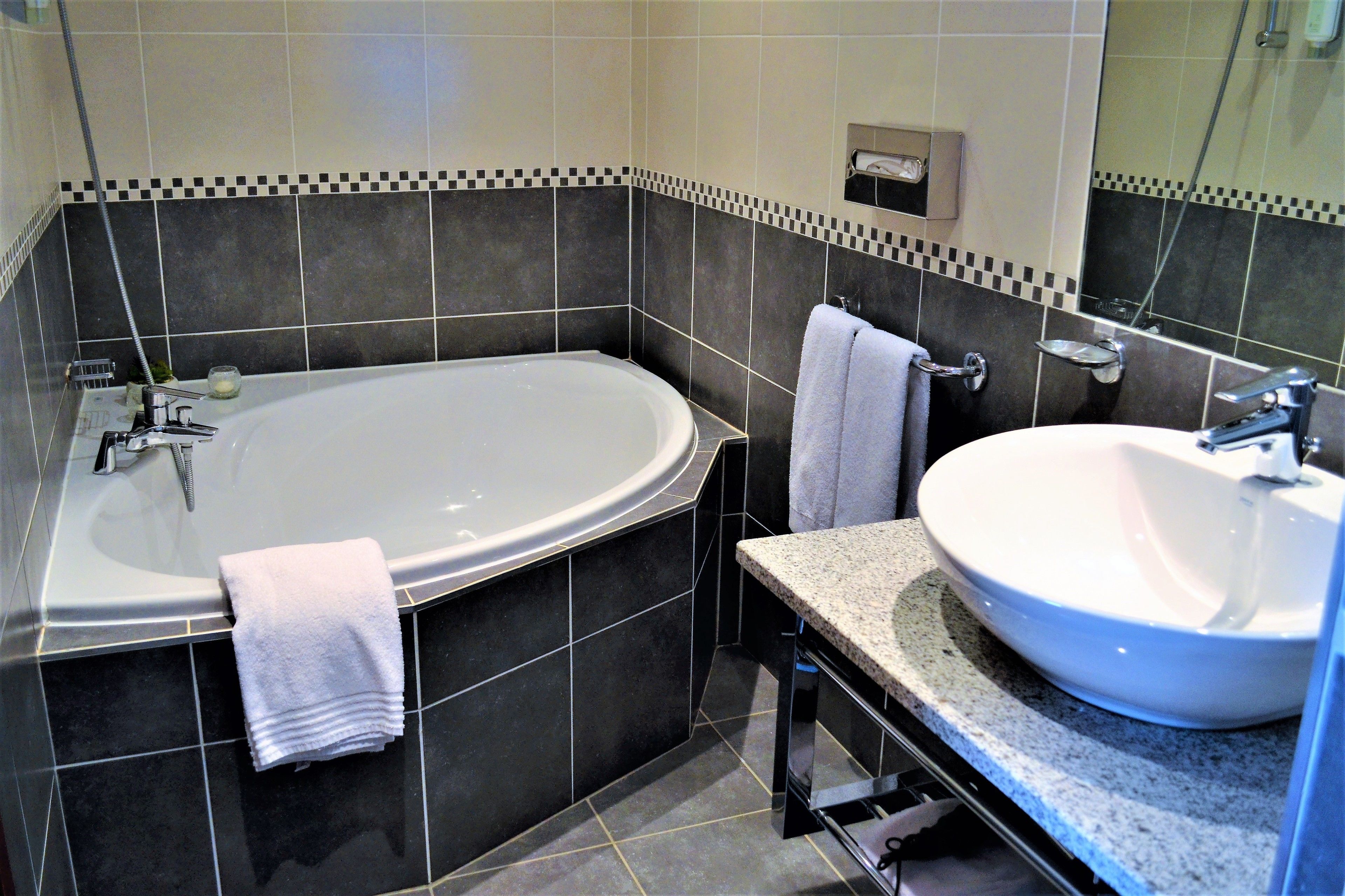 superior double room | bathroom | free toiletries, hair dryer, towels