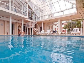 Indoor pool, outdoor pool, pool umbrellas, pool loungers