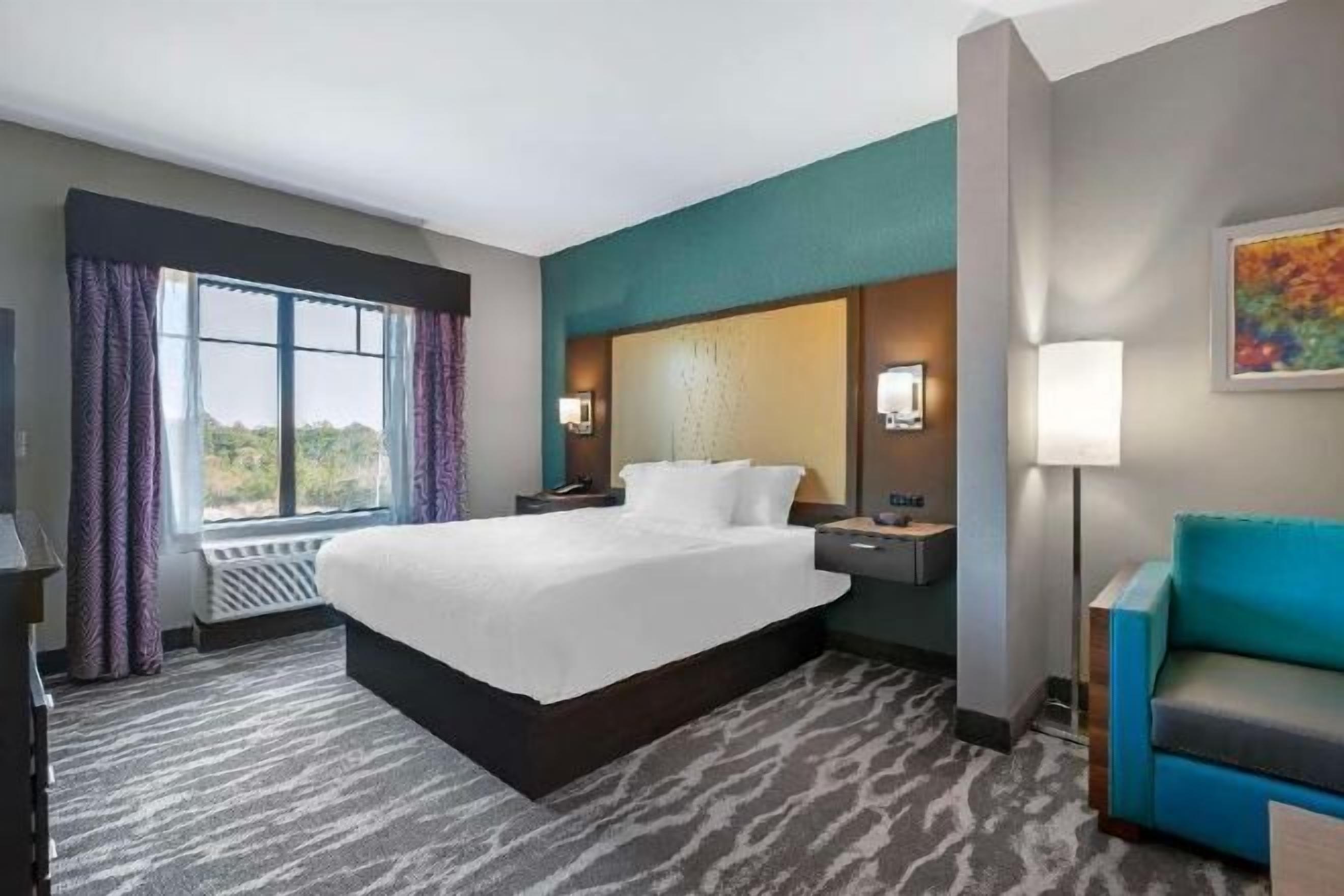 Desk, laptop workspace, blackout drapes, iron/ironing board