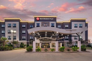 A Best Western PLUS hotel with a modern design, featuring a covered entrance and multiple floors.