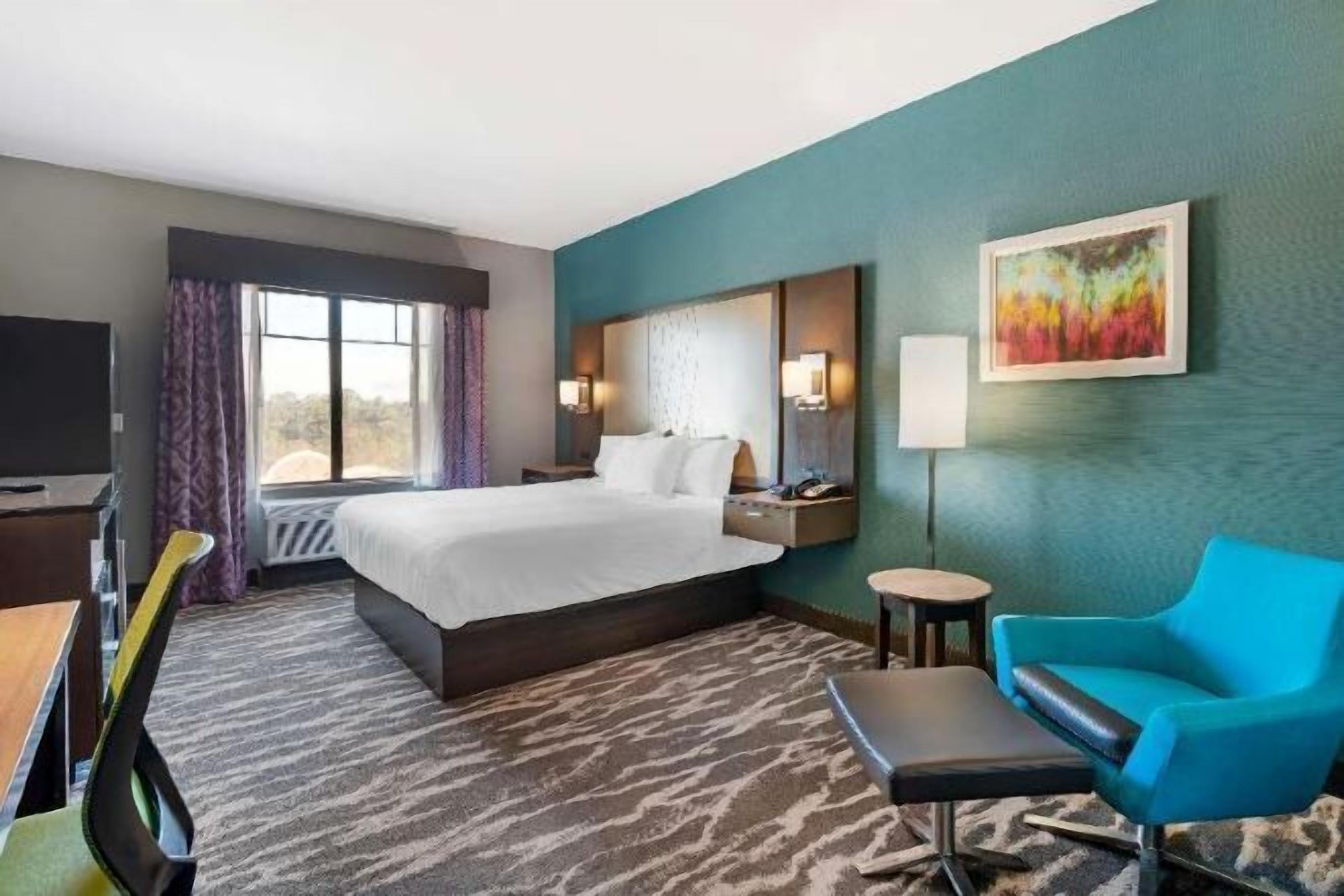 Desk, laptop workspace, blackout drapes, iron/ironing board