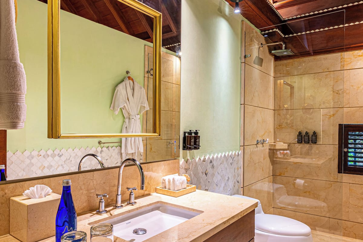 suite, 1 king bed | bathroom | shower, free toiletries, hair dryer, heated floors