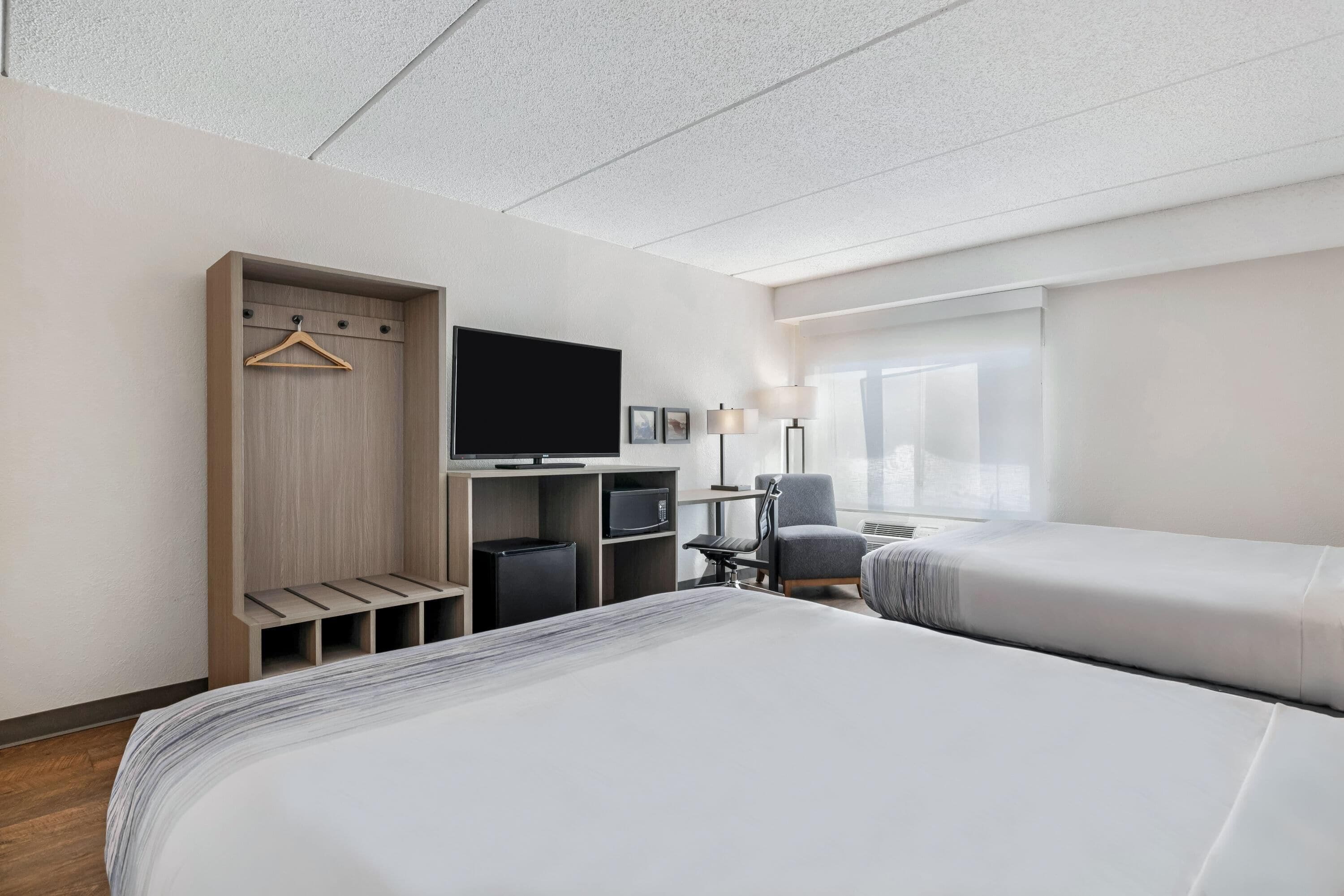 Room, 2 Queen Beds, Non Smoking (Pet-friendly) | Hypo-allergenic bedding, desk, blackout curtains, iron/ironing board