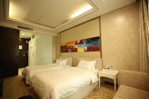 A hotel room with two beds, a small bedside table, a chair, and a colorful abstract wall art. - Crown Crystal Hotel (Shanghai)