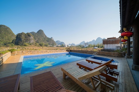 Outdoor pool, open 10:00 AM to 9:30 PM, sun loungers. Yangshuo Tea Cozy Boutique Hotel