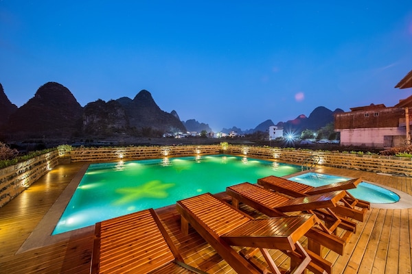 Outdoor pool, open 10:00 AM to 9:30 PM, sun loungers