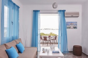 Deluxe Apartment | Living area | TV