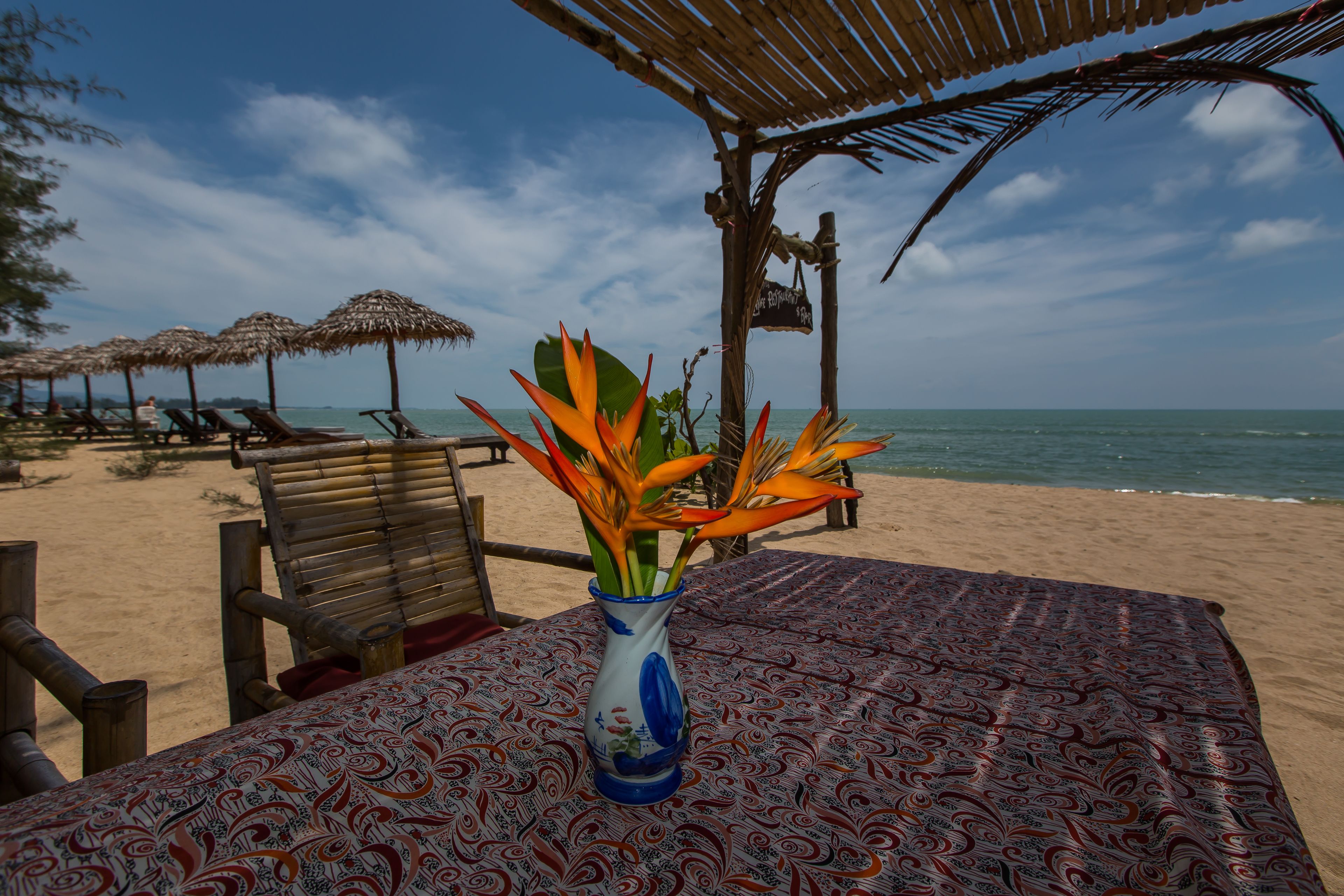 on the beach, beach umbrellas, beach towels, beach massages