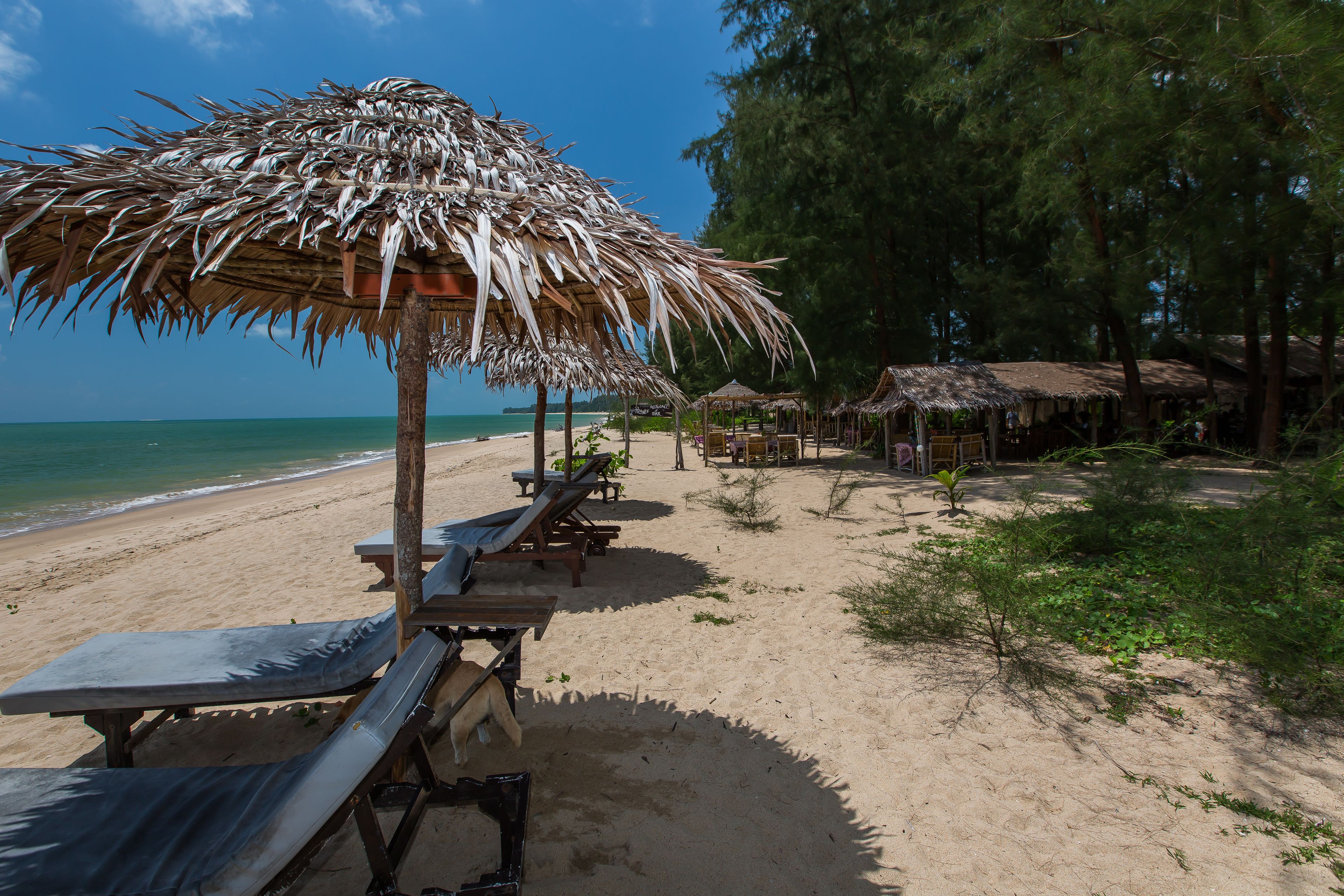 on the beach, beach umbrellas, beach towels, beach massages