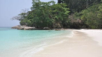On the beach, beach umbrellas, beach towels, beach massages