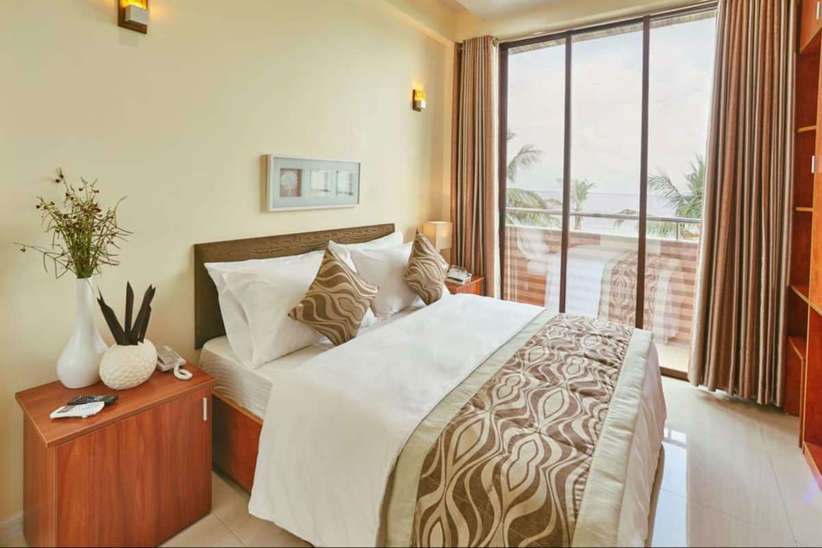 Habitación Deluxe, vista al mar | Ropa de cama de alta calidad y caja de seguridad en la habitación