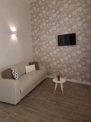 Flat-screen TV - La Banchina Holiday Rooms (Trani)