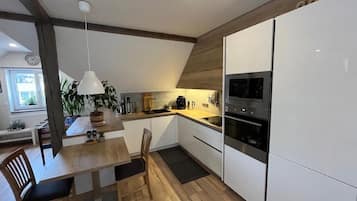 Apartment | Private kitchen | Fridge, stovetop, electric kettle, cookware/dishes/utensils