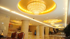 A spacious lobby with a reception desk, plush seating, and multiple chandeliers. - Wuhan Sentai Zhongyang Hotel (Wuhan)