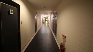 A hotel hallway with doors numbered 212, 208, and 207. - Hotel Bibi - Adults Only (Kashiba)