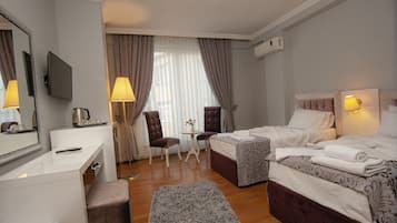 Standard Twin Room | Minibar, in-room safe, desk, soundproofing