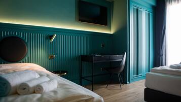Triple Room, Balcony | In-room safe, desk, free WiFi, bed sheets