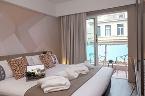 Family Room, Balcony, City View | Premium bedding, minibar, in-room safe, desk