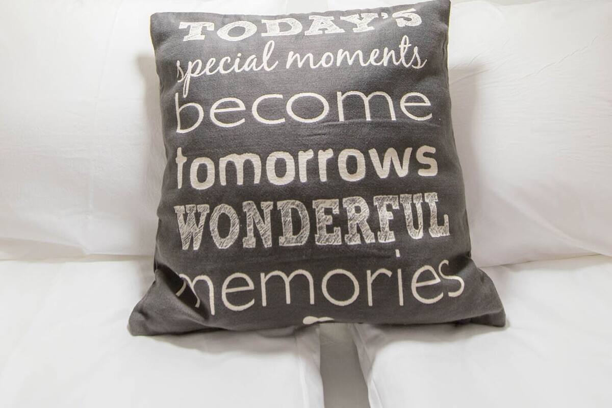 A pillow with text on it.