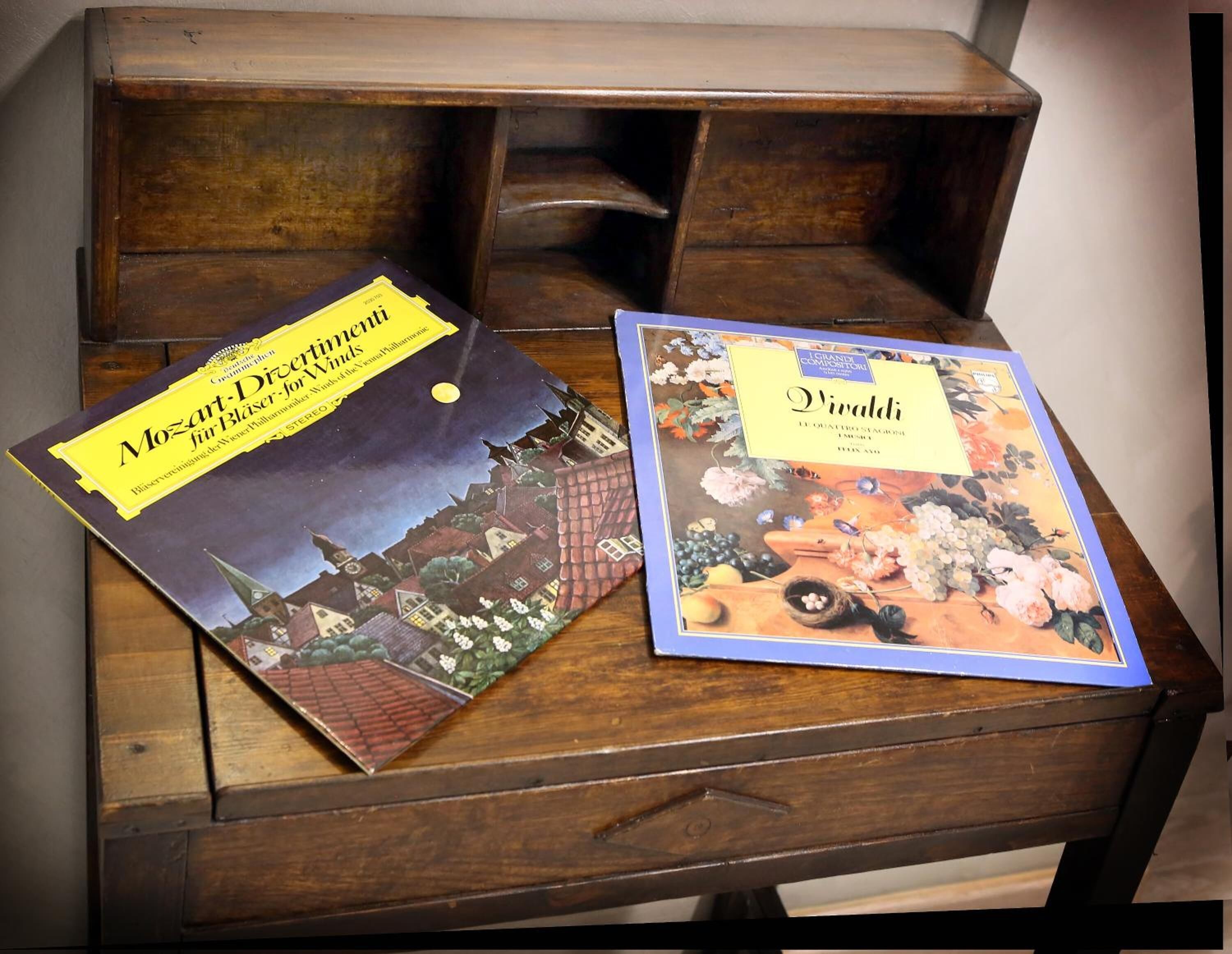 Two books on a wooden table.