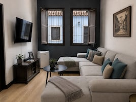 Three-Bedroom House | Living area | 42-inch Smart TV with cable channels, TV