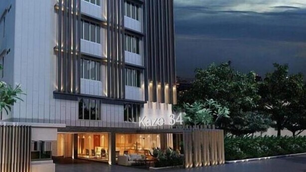 A modern hotel building with a flat roof, large windows, and a sign reading "Kaze 34". - The Kaze 34 Hotel and Serviced Residence (Bangkok)