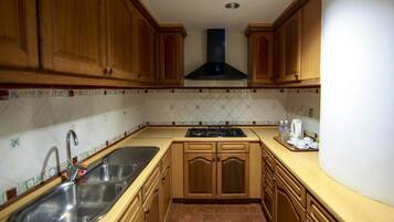 Standard Apartment, 2 Bedrooms | Private kitchen | Full-size fridge, stovetop, coffee/tea maker, electric kettle