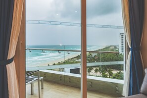 A balcony with a view of the beach and ocean. - Swandor Cam Ranh Resort-Ultra All Inclusive (Cam Lam)