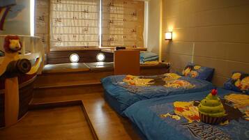 Family Quadruple Room, 1 Bedroom | Individually decorated, individually furnished, blackout drapes