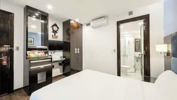 Standard Double Room | Minibar, in-room safe, blackout drapes, iron/ironing board