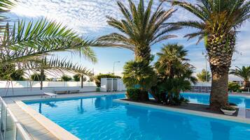 Seasonal outdoor pool, open 8:00 AM to 7:30 PM, sun loungers