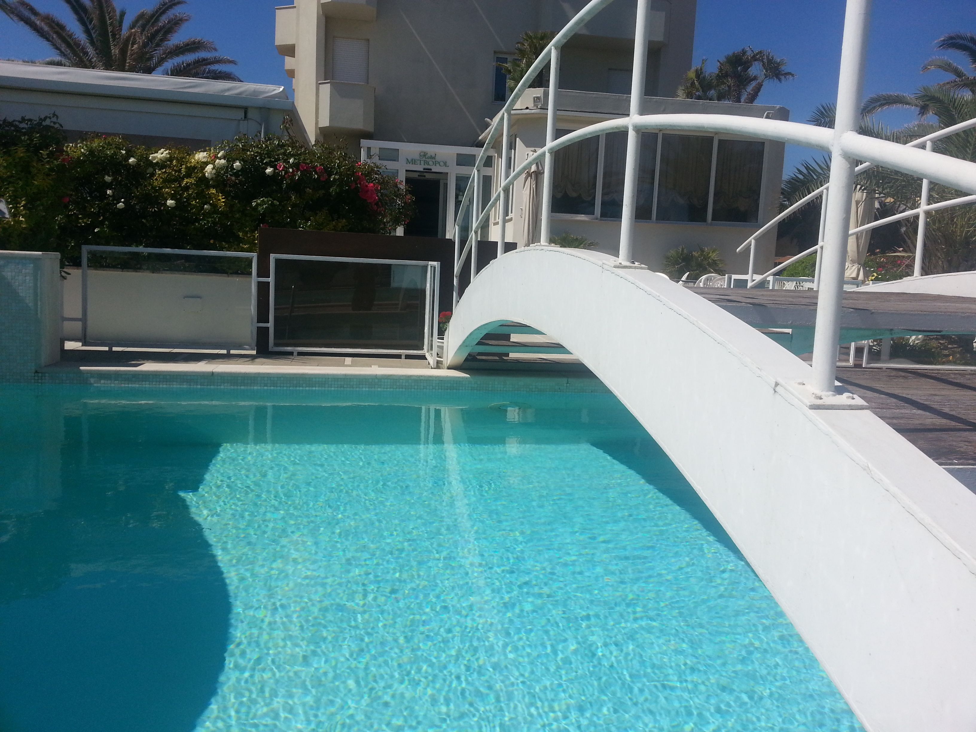 seasonal outdoor pool, open 8:00 am to 7:30 pm, pool loungers