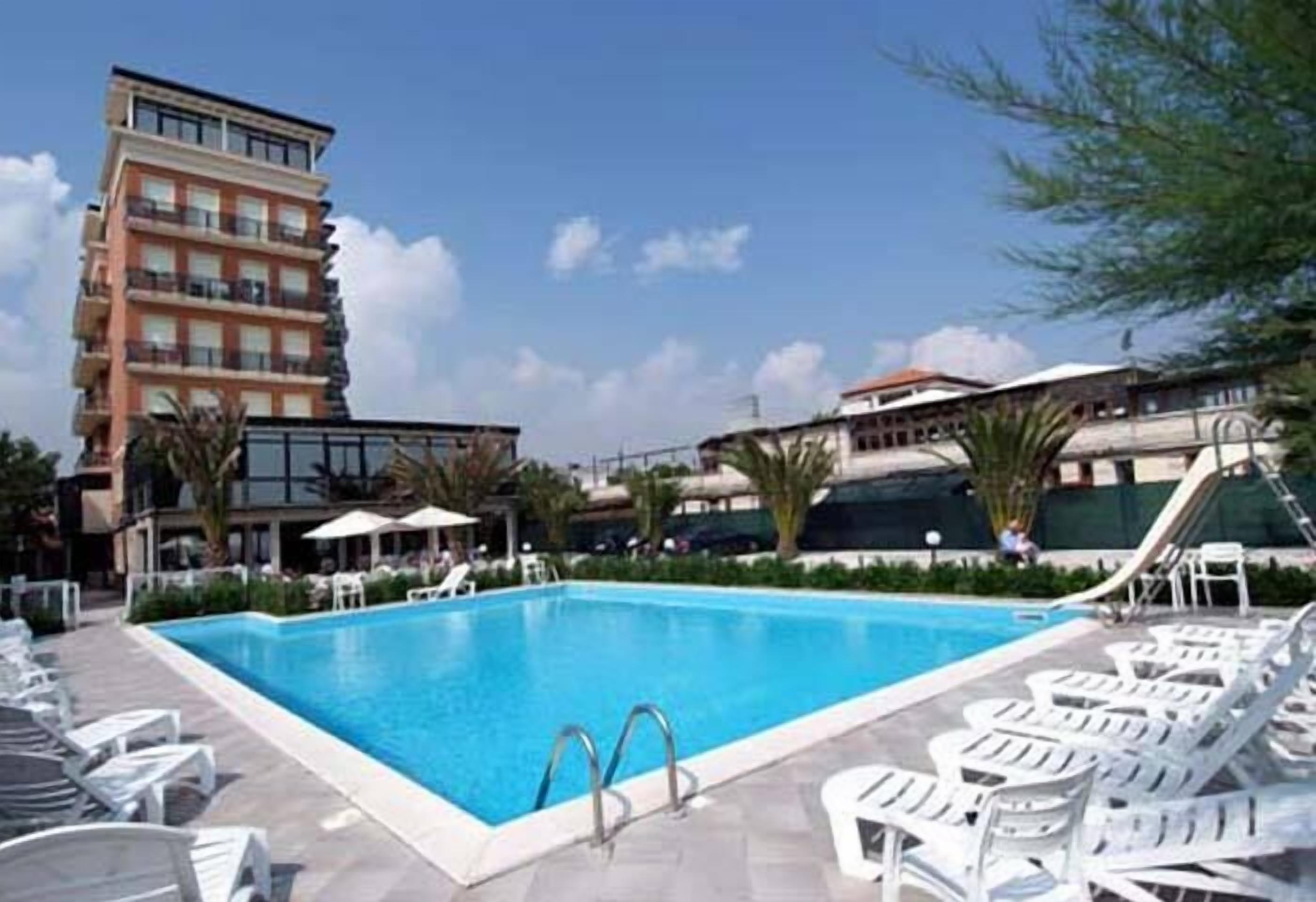 seasonal outdoor pool, pool umbrellas, pool loungers