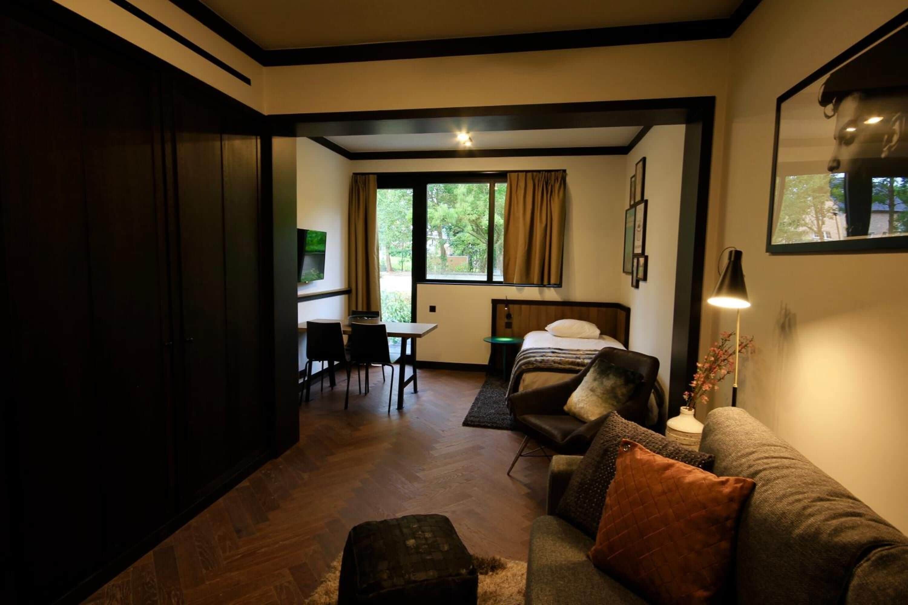 Estudio Deluxe, Terraza | Sala de estar | Televisión de pantalla plana de 32 pulgadas con canales por cable 