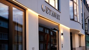 A modern building with a sign reading "GETAWAY".
