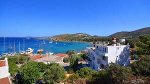 A coastal town with a marina, buildings with balconies, and a clear blue sky. - Doada Hotel (Datça)