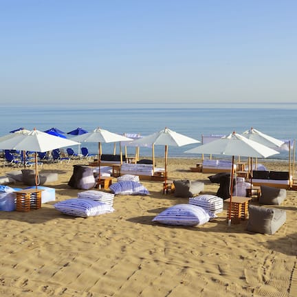 On the beach, sun loungers, beach umbrellas, beach towels