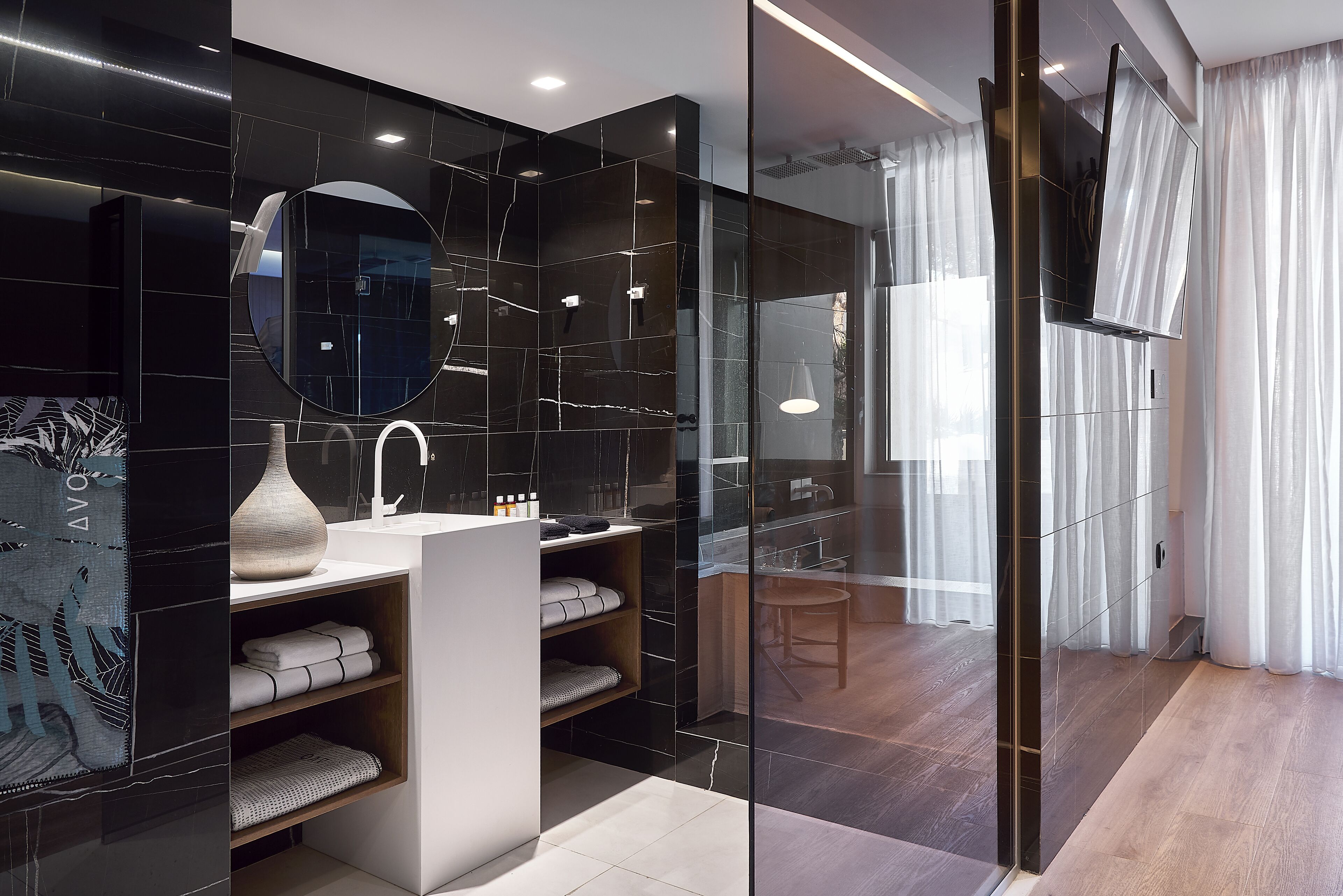 separate bathtub and shower, rainfall showerhead, designer toiletries