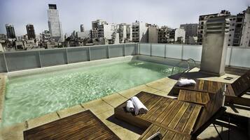 Outdoor pool, open 9:00 AM to 8:00 PM, free cabanas