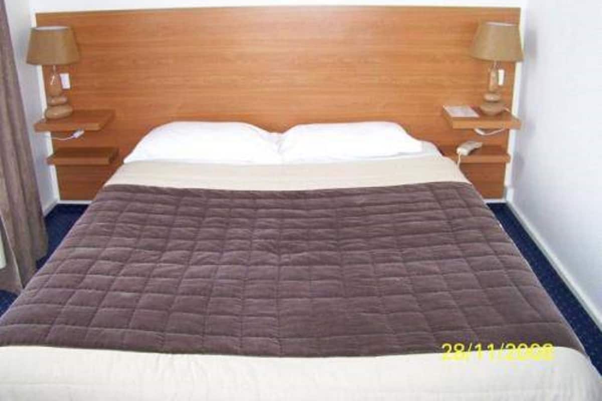 Ropa de cama de alta calidad y tabla de planchar con plancha