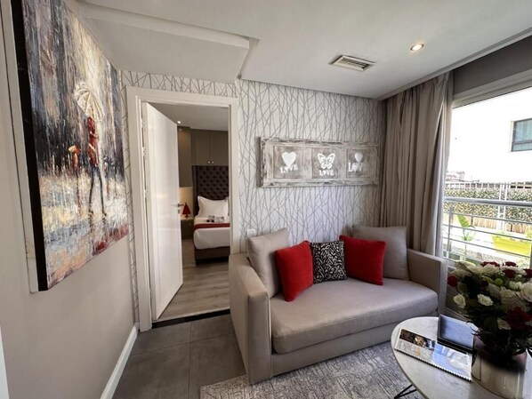 Suite (Ambassadeur) | Living area | Flat-screen TV - Rent Inn Suites (Rabat)