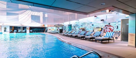 Outdoor pool, open 7:00 AM to 7:00 PM, pool loungers, lifeguards on site