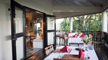 Breakfast, lunch, dinner served; Fusion cuisine, garden views